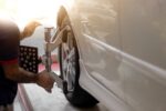 Vehicle,Wheel,Alignment.,Tyre,Wheel,Alignment.,Technician,Placing,Sensors,To